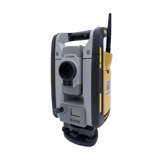 Used Trimble RTS673 robotic total station, front angle showing battery compartment side and radio antenna